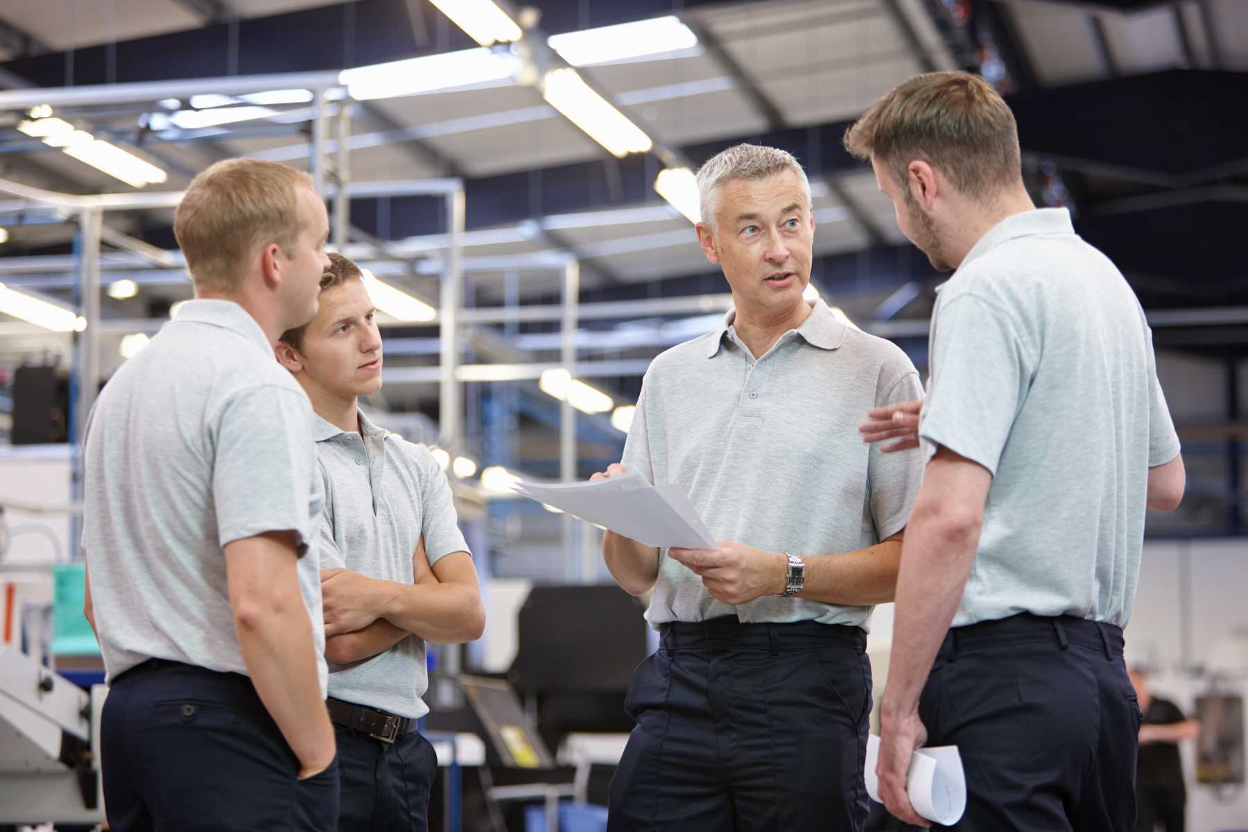 workers-meeting-in-engineering-factory-5L2BJT4.jpg